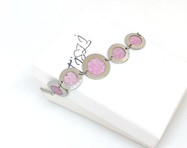 Light pink resin bubble on stainless steel bracelet