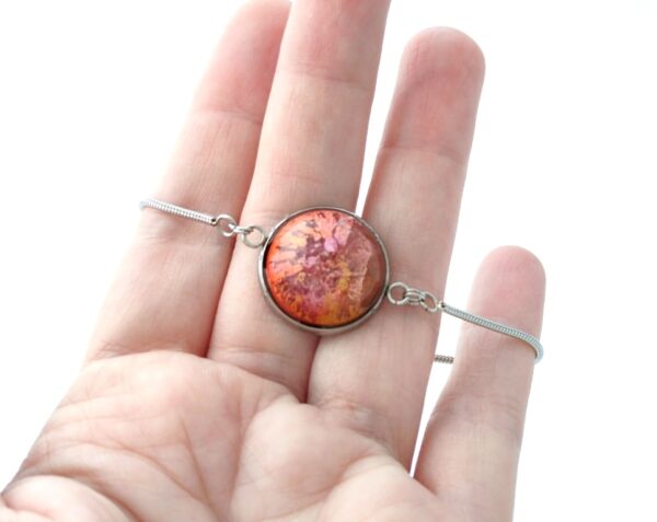 Autumn colored resin dome on stainless steel bracelet