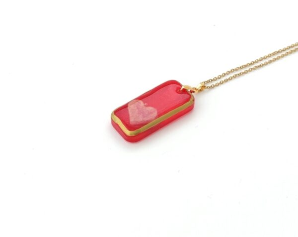Pink heart in red brick, resin pendant