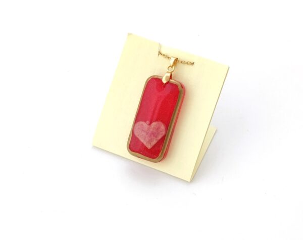 Pink heart in red brick, resin pendant
