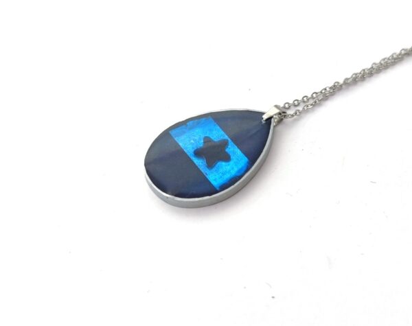 Resin drop pendant with blue star
