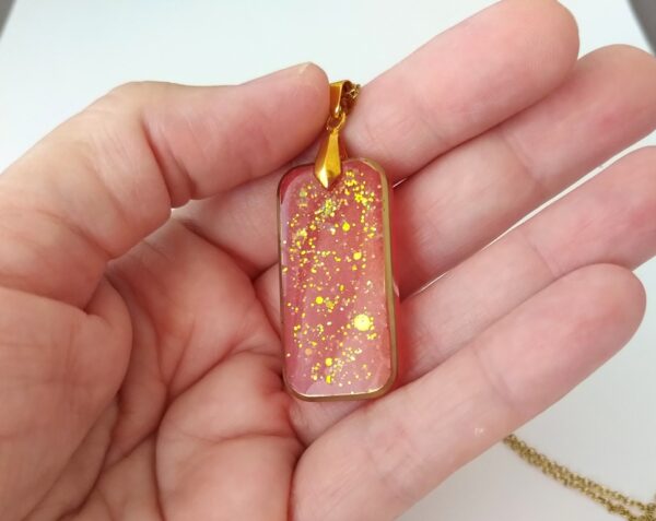 Brick resin pendant is red and gold colors