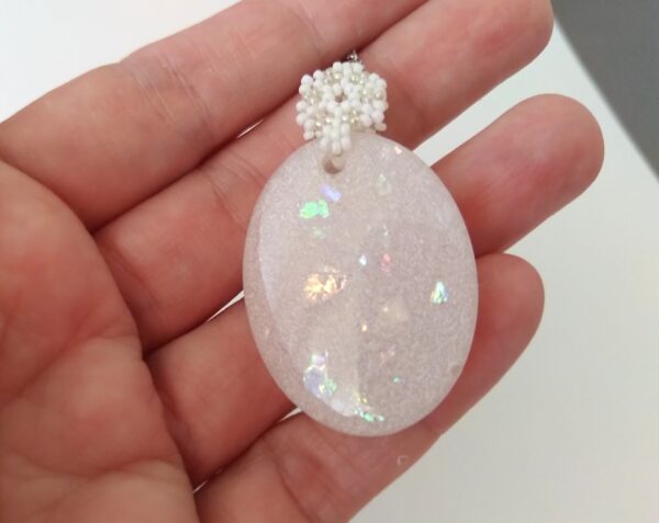 White opal, shiny, resin oval pendant