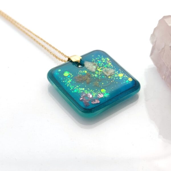 Treasures in turquoise sea, resin cube pendant