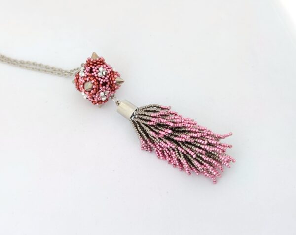 Pink and silver spiked ball with beadtassel pendant