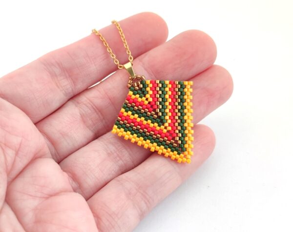 Arrow beaded pendant in jamaican colors