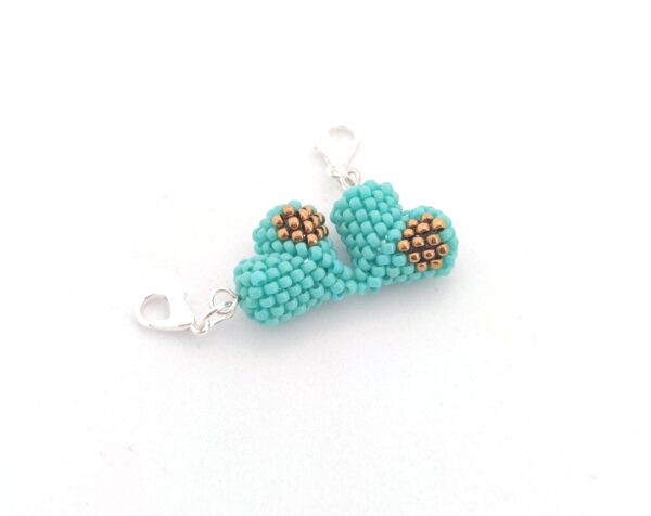 Heart in a heart charm in turquoise and bronze color