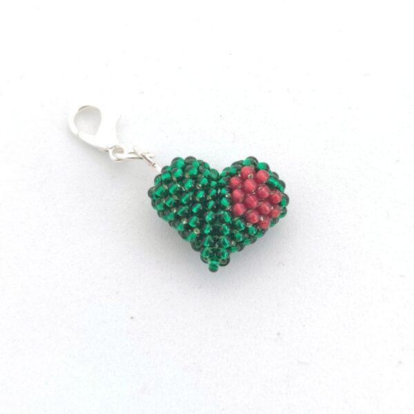 Heart in a heart charm in green and dark red color
