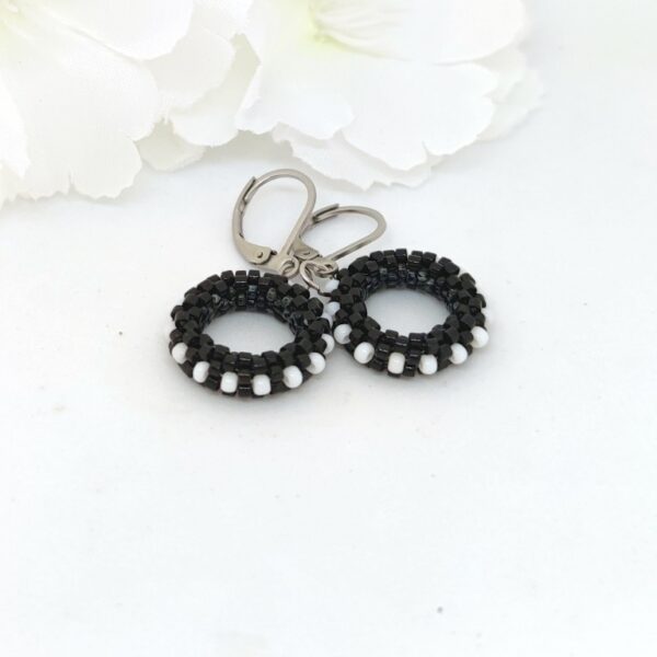 Small hoop earrings in black and white colors