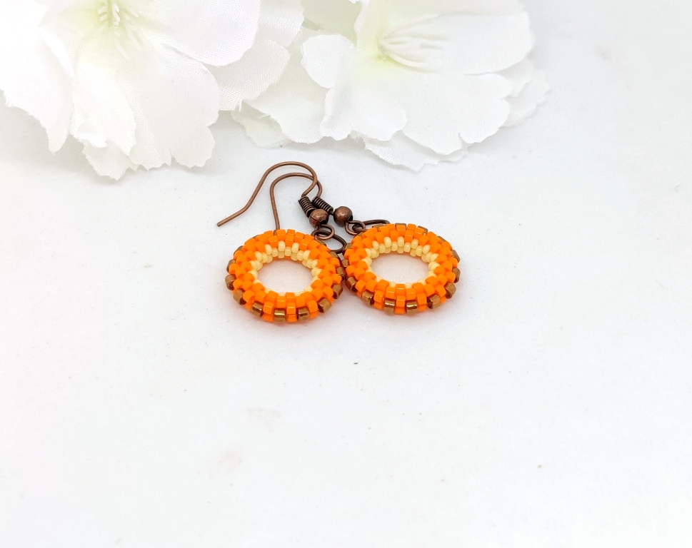 Small hoop earrings in orange, yellow and bronz colors