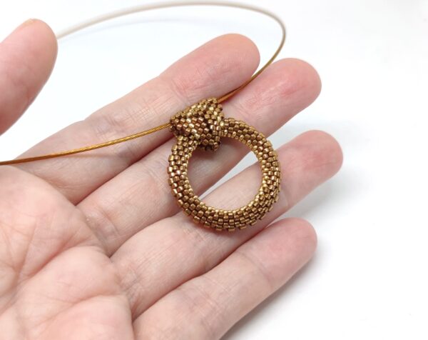 Hoop pendant in bronze and gold colors