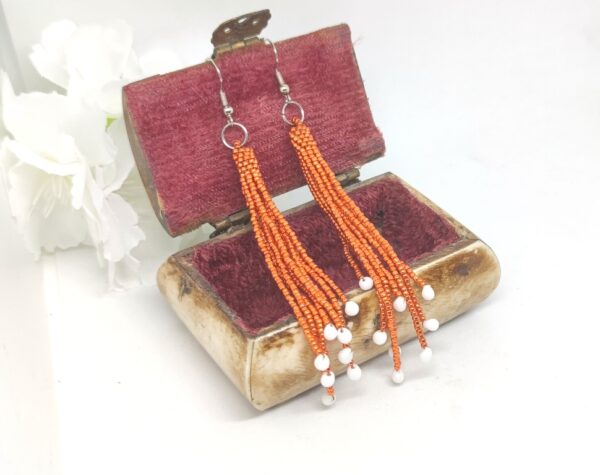 Fringe earrings in metallic orange color