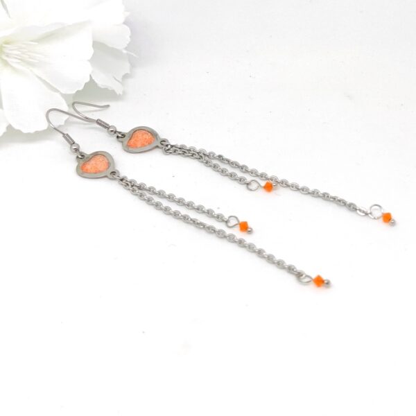 Heart earrings with long chain tassel, orange glitter