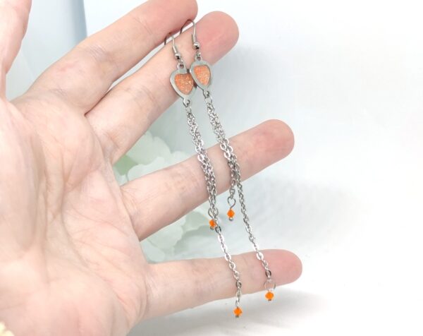 Heart earrings with long chain tassel, orange glitter