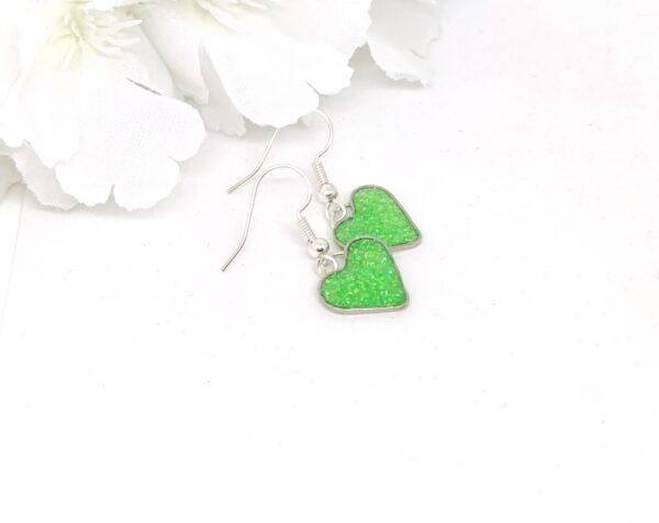 Heart earrings with green glitter