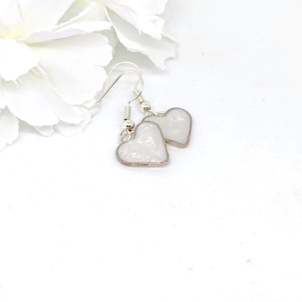 Heart earrings with pearl white resin