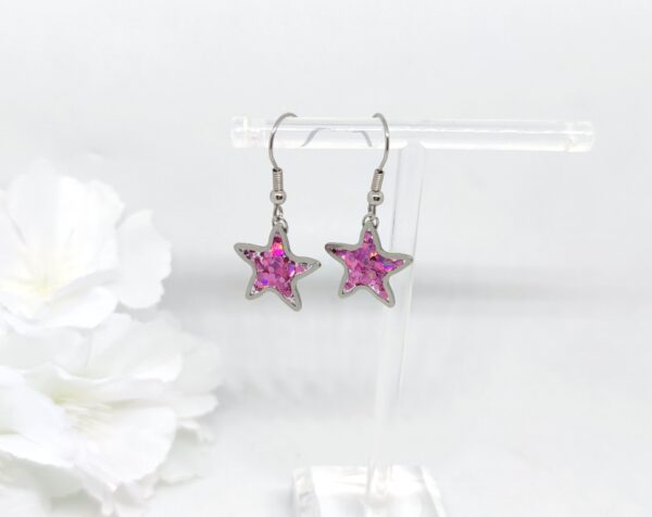 Star earrings with purple, chunky glitter