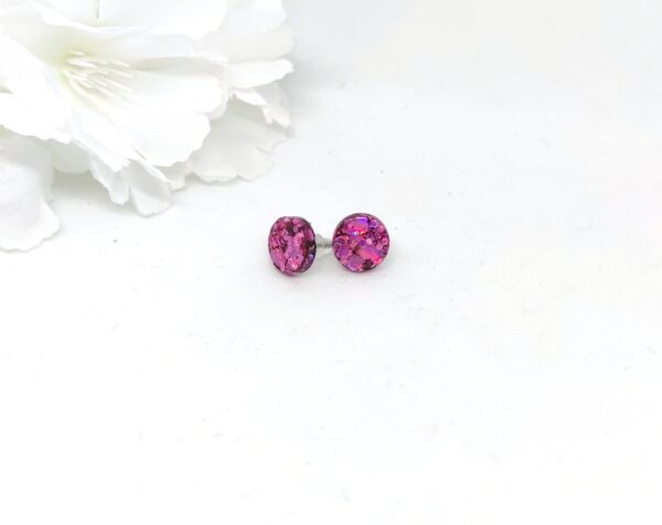 Round, stud earrings with purple, chunky glitter