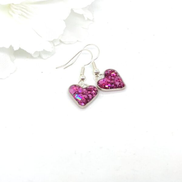 Heart earrings with purple, chunky glitter