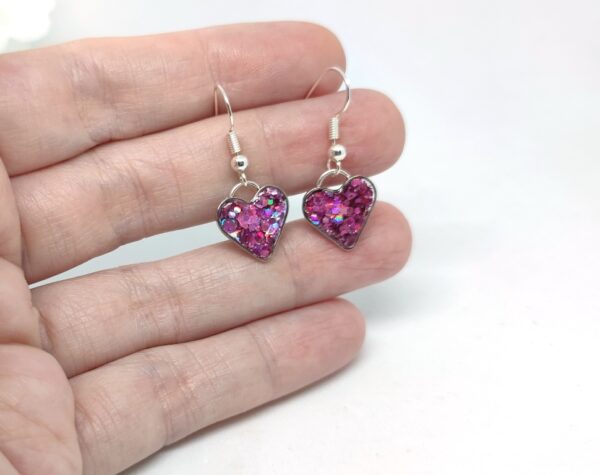 Heart earrings with purple, chunky glitter
