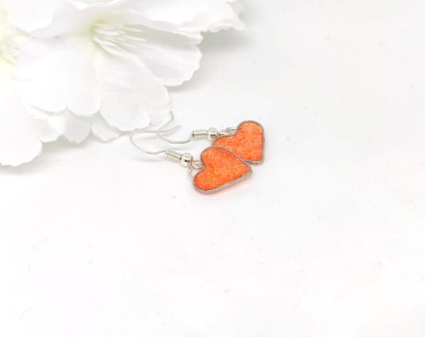 Heart earrings with orange glitter