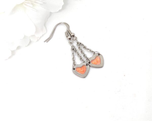 Heart earrings with chain, orange glitter
