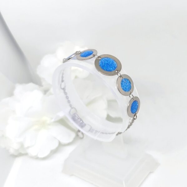 Bubbles with resin in glittery blue color, stainless steel bracelet