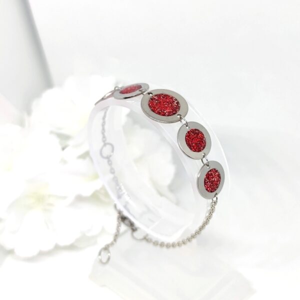 Bubbles with resin in glittery red color, stainless steel bracelet