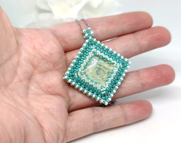 Beaded cube pendant with resin caboshon in turquoise color