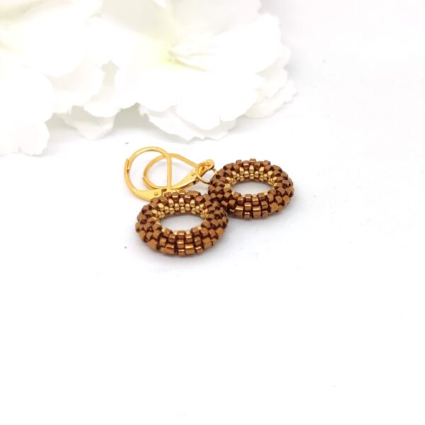 Small hoop earrings in bronz and gold colors