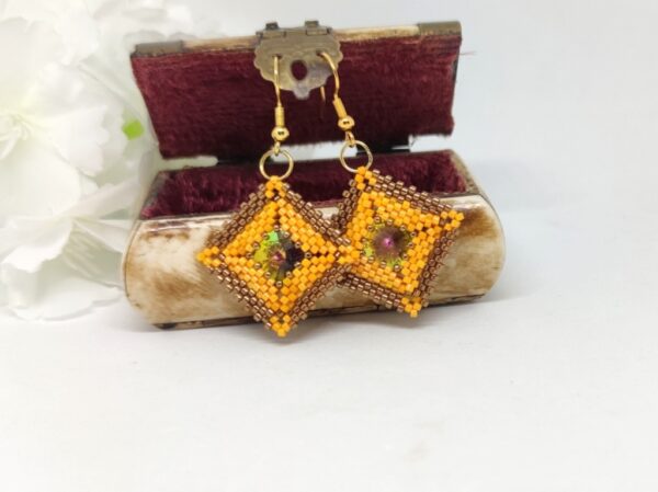 Pillow square, beaded earrings in bronze and orange colors