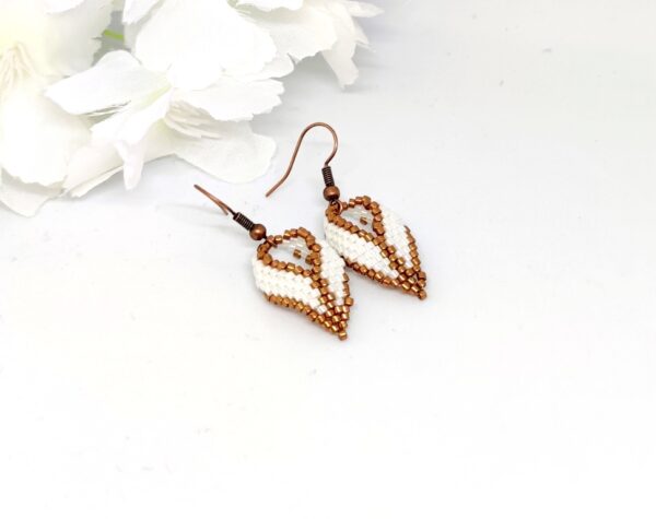 Twisted, beaded earrings in bronze and white colors