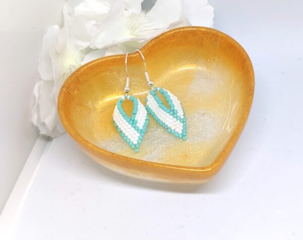 Twisted, beaded earrings in turquoise and white color