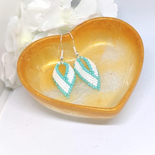 Twisted, beaded earrings in turquoise and white color