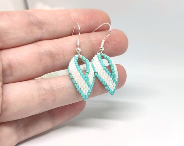 Twisted, beaded earrings in turquoise and white color