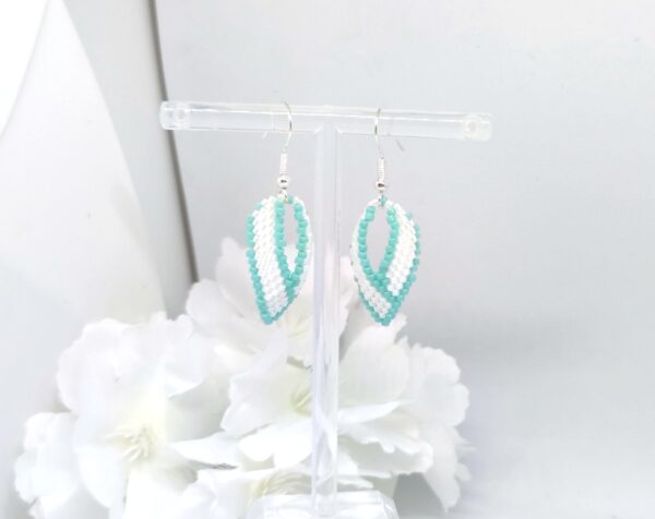 Twisted, beaded earrings in turquoise and white color