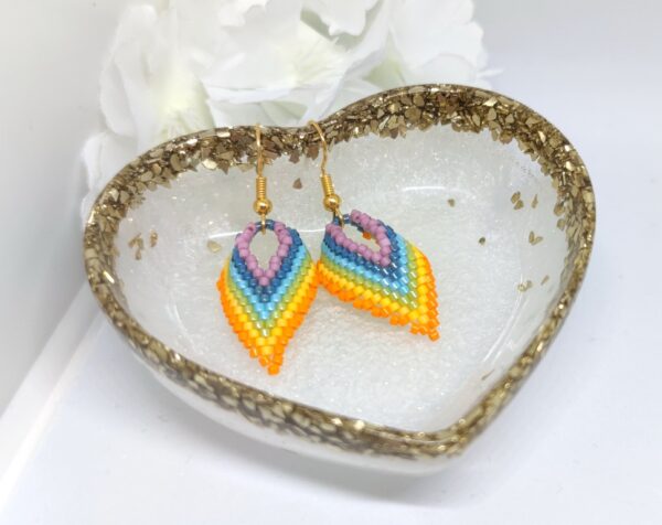 Twisted, beaded earrings in rainbow colors