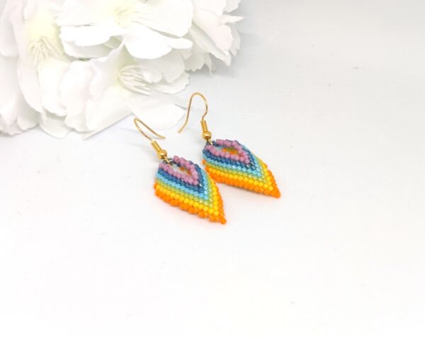 Twisted, beaded earrings in rainbow colors