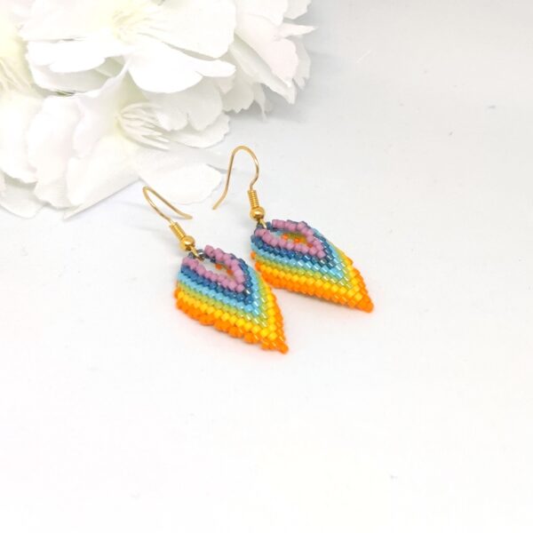 Twisted, beaded earrings in rainbow colors