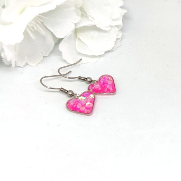 Heart earrings with pink, chunky glitter